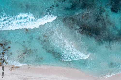 Aerial View of Tropical Water with Sandy Beach Shore © Dave Vagiunic