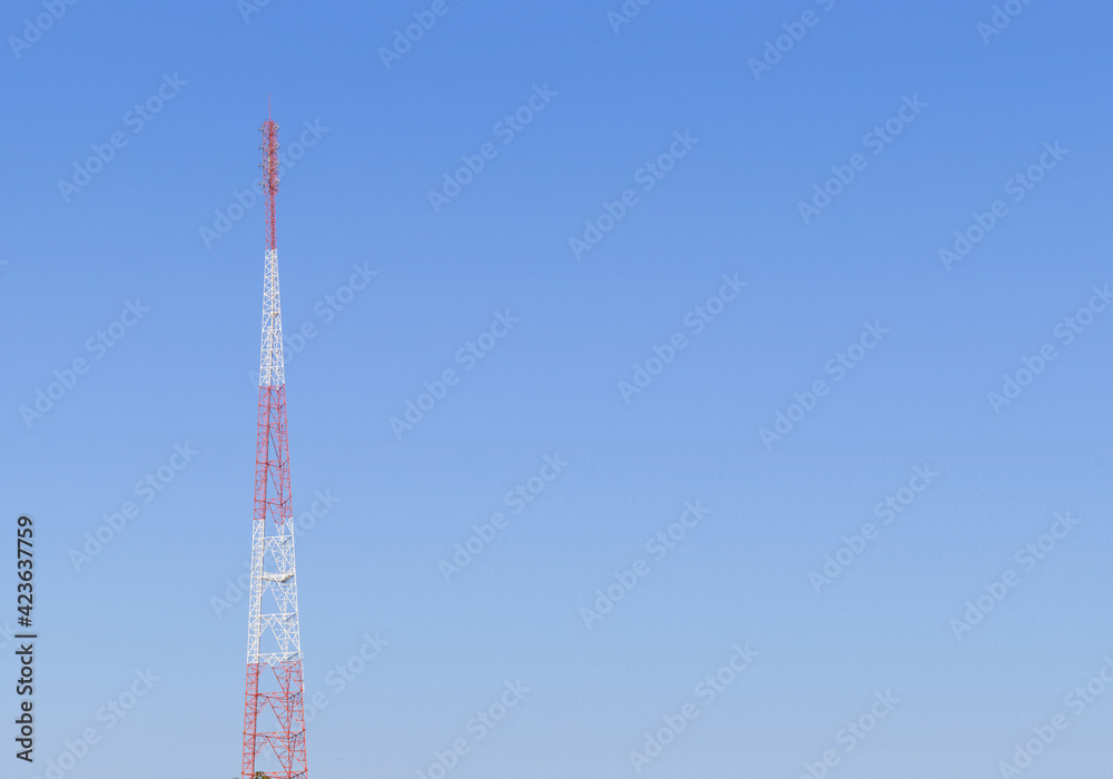 communication construction pole on clear blue sky. the high radio antenna tower in thailand. communication construction pole on clear blue sky. the high radio antenna tower in thailand.