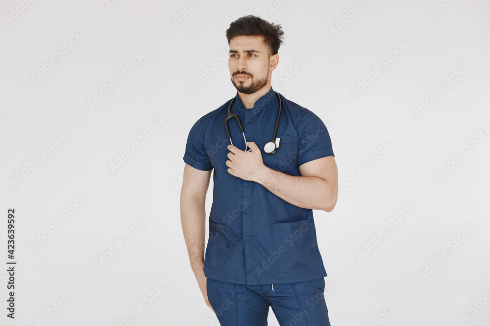 A portrait of a medical doctor posing against white background A portrait of a medical doctor posing against white background