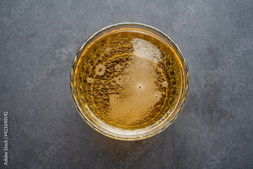 A glass of beer on a black background