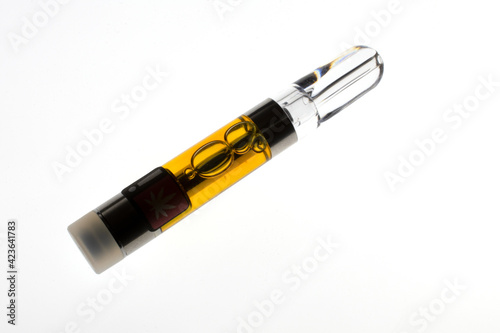 фотографія Backlit marijuana vape pen cartridge, with amber-colored resin extract