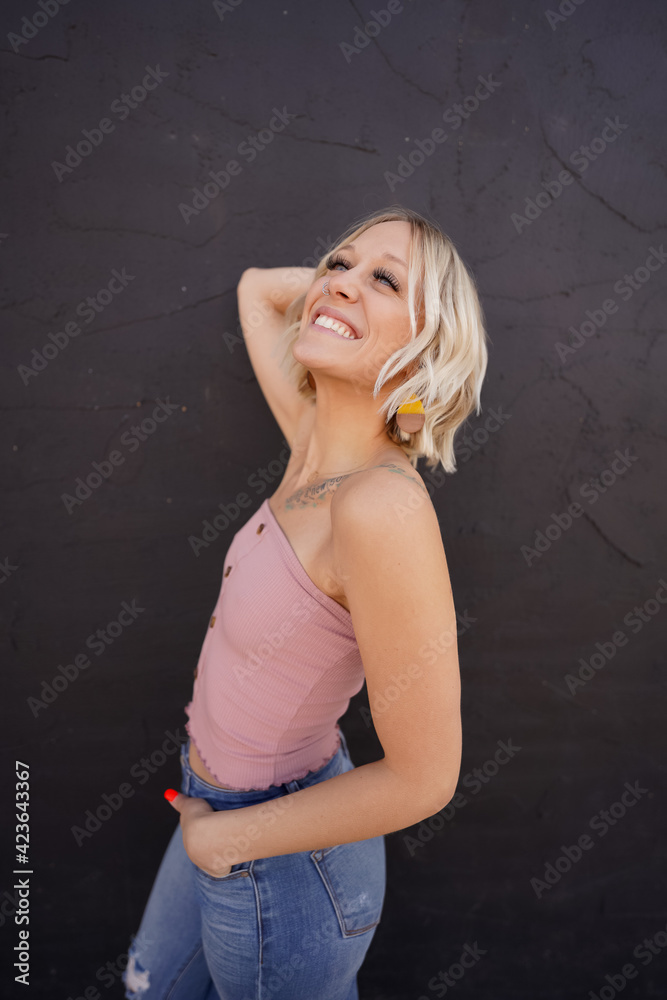 blonde woman posing on the street blonde woman posing on the street
