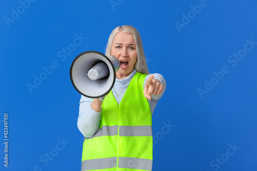 Mature woman in vest and wi...