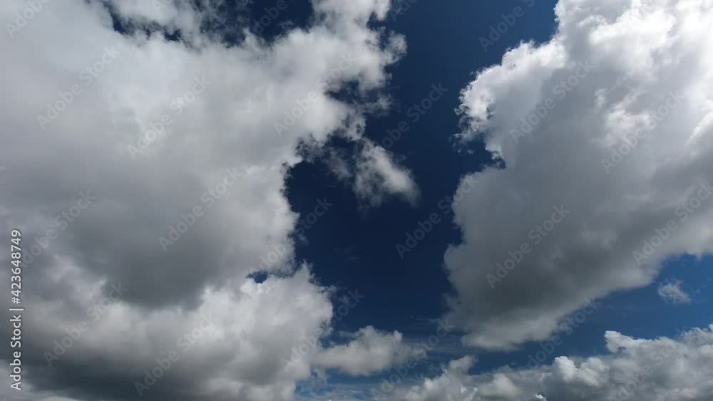 Clouds pass by blue sky as weather changes to rain cloud, time lapse Clouds pass by blue sky as weather changes to rain cloud, time lapse