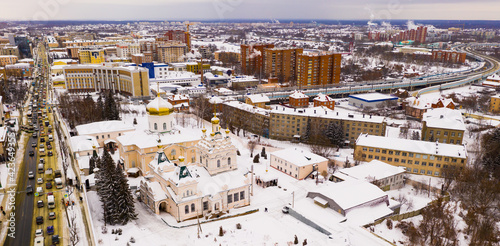 Aerial panoramic view of architectural complex of Holy Trinity Convent in Russian town of Penza on winter day.