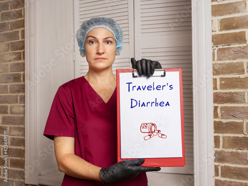 Conceptual photo about Traveler's Diarrhea with handwritten text. photo