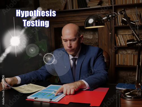  Hypothesis Testing Businessman, executive manager hand filling paper business document