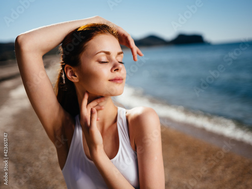Pretty woman in white swimsuit charm sun enjoying nature island