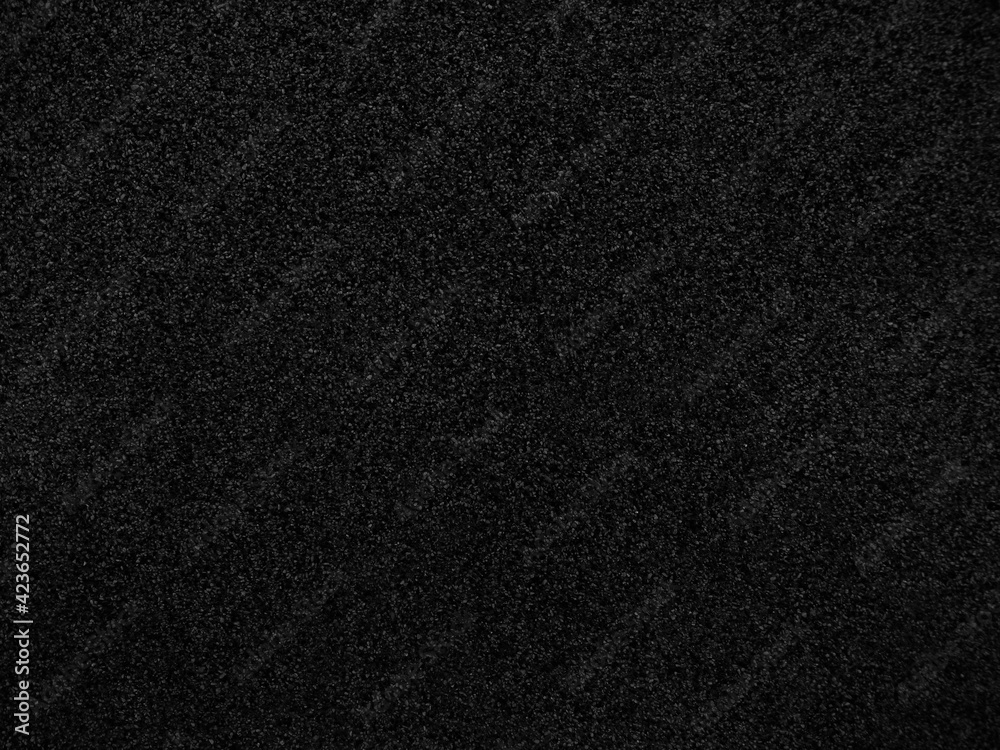 Black abstract background. Concrete wall finished with marble chips. Black stone background with copy space for design. Web banner. Black abstract background. Concrete wall finished with marble chips. Black stone background with copy space for design. Web banner.