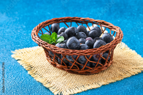 Blueberries, bog whortleberry, great biberry on a blue background. photo