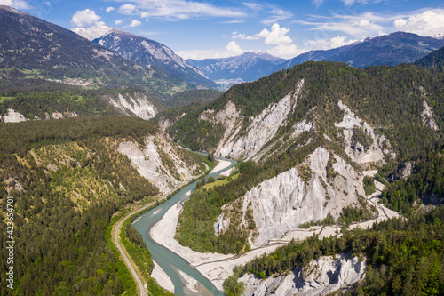 Dramatic aerial view of the Rhine gorge near Reichenau and Films in Canton Graubunden in the alps in Switzerland on a sunny summer day © jakartatravel