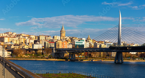 Golden Horn Halic Metro Bridge in Istanbul, Turkey against blue sky