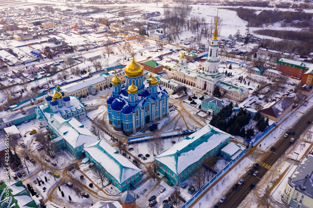 Winter view from a drone of the Nativity-Bogoroditsky monastery in the center of the city of Zadonsk surrounded ..by residential buildings, Russia