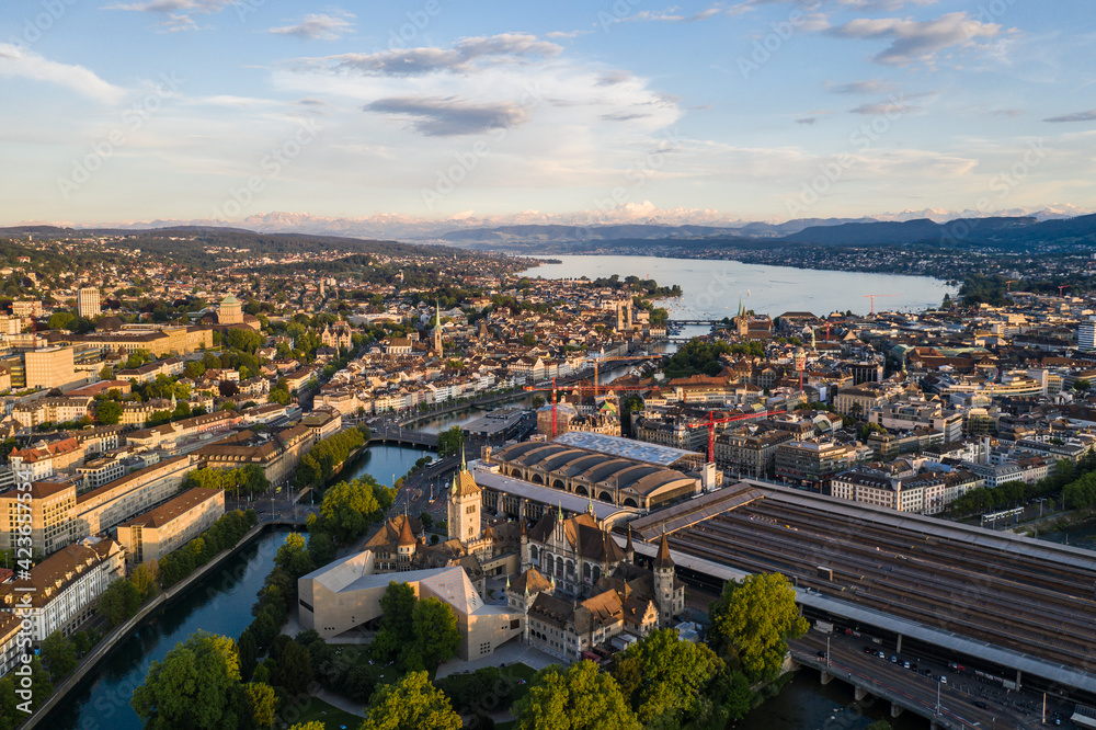 Dramatic aerial view of the Zurich downtown with the national museum, the main train station and the Limmat river that flow through the old town to reach lake Zurich in Switzerland