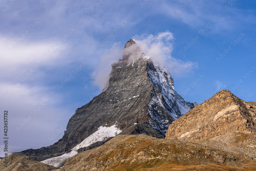 Dramatic view of the Matterhorn peak, Cervin in French, a symbol of Switzerland in Canton Valais in Switzerland