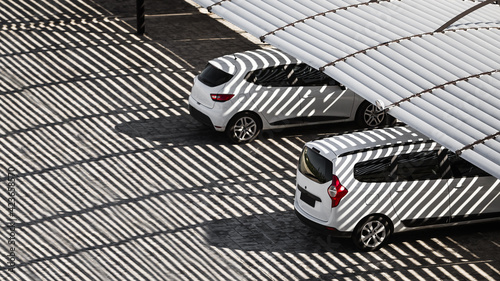 Cars under the shadow from the canopy