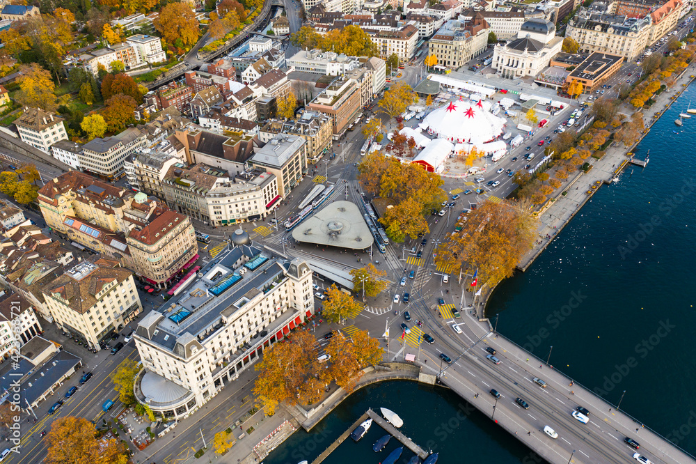 Aerial view of the Zurich Quay bridge where the Limmat river meets lake Zurich and the Bellevue square, an upscale district of the largest city in Switzerland in autumn