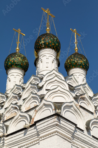 The church is richly decorated with brick carvings. The top of the church is decorated with 105 kokoshniks and five domes. Church of St. Nicholas on Posad in Kolomna. Russia. photo