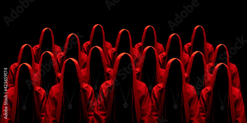 Foto People dressed in a red robes looking like a cult members on a dark background