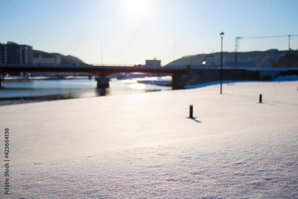 background of fresh snow texture with cityscape in Hokkaido, Japan