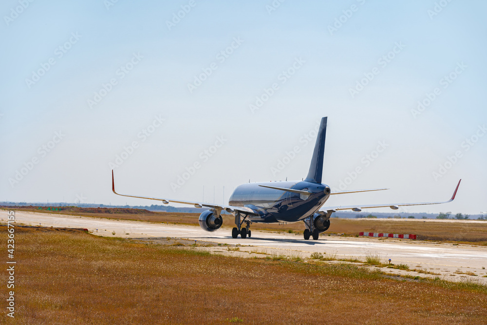 Big passenger airplane drives along the runway in airport Big passenger airplane drives along the runway in airport