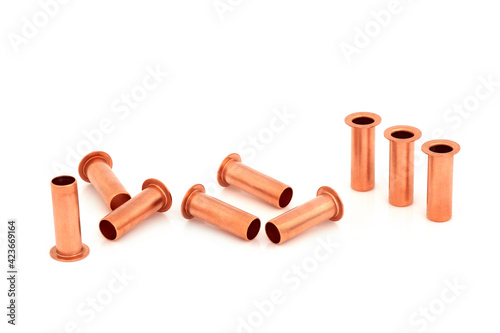 Copper inserts 10 mm used in plumbing to stop pipe collapsing when used with compression fittings. In a group on white background.