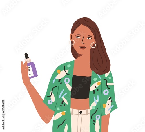 Young woman reading cosmetic label with ingredient list. Female character hol...