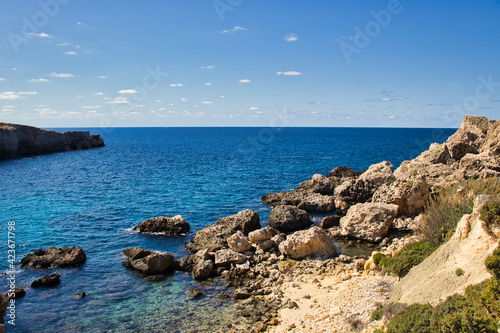 Blue ocean water at Prajjet Bay or Anchor Bay in Malta on a warm fall day. photo