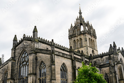 Old building of St Giles Cathedral on the historic Royal Mile street and area, in a cloudy summer day in Edinburgh, Scotland.