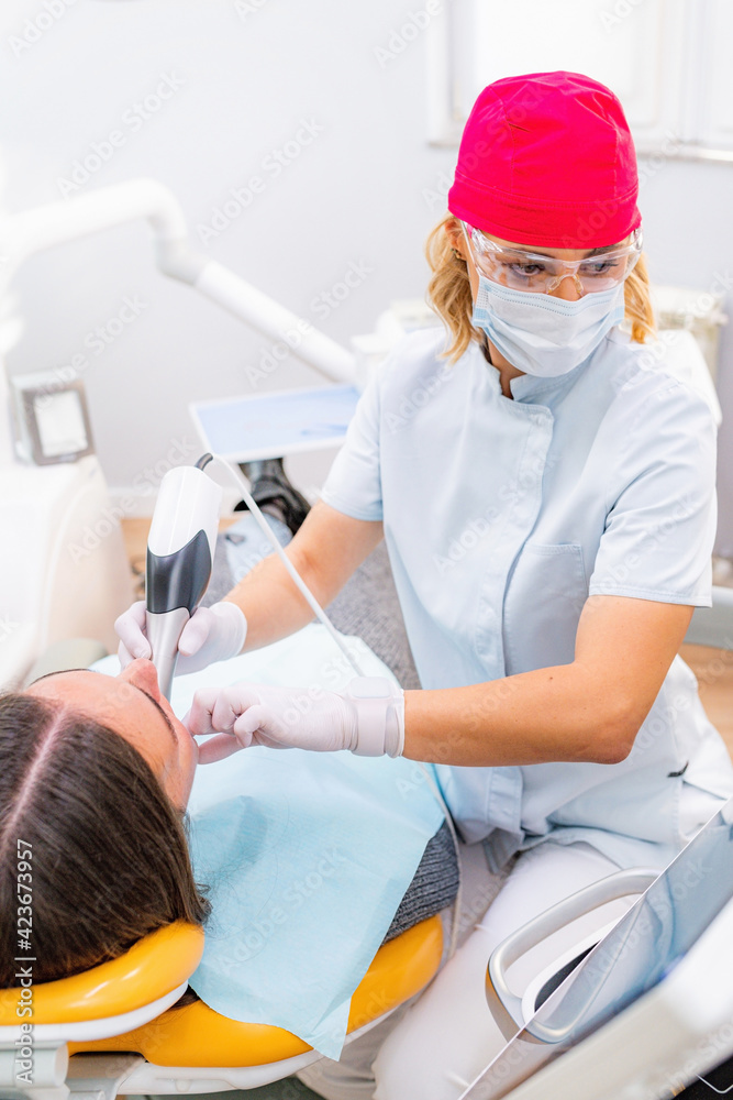 Dental Prosthodontics. Dentist Using 3D Camera in Teeth Reconstruction Procedure Dental Prosthodontics. Dentist Using 3D Camera in Teeth Reconstruction Procedure