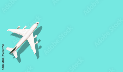 Airplane on a colored blank banner background. Vacation, flying and tourism background minimal concept.