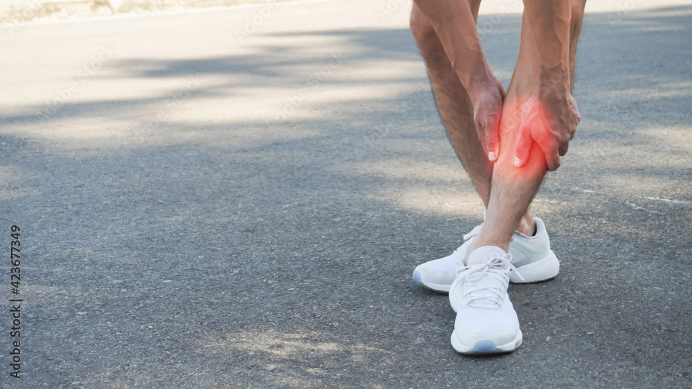Closeup man shin pain, Running with a sore shin, Shin Splint Syndrome