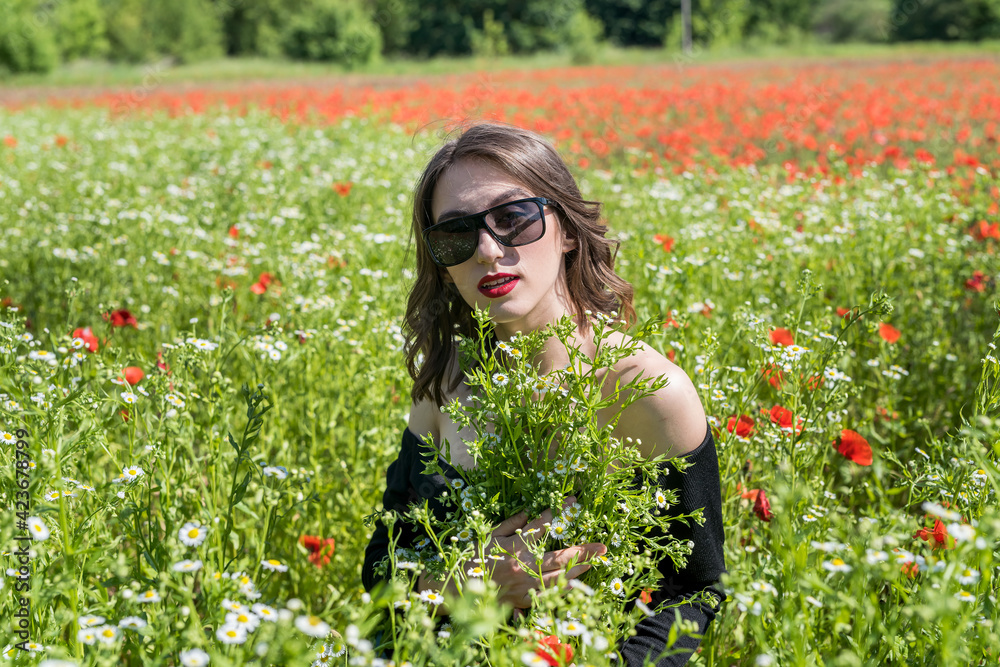 Beautiful young woman in field of flowers daisies, enjoy nature Beautiful young woman in field of flowers daisies, enjoy nature
