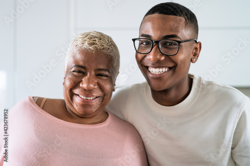 Happy smiling Hispanic mother and son portrait - Family love and unity concept