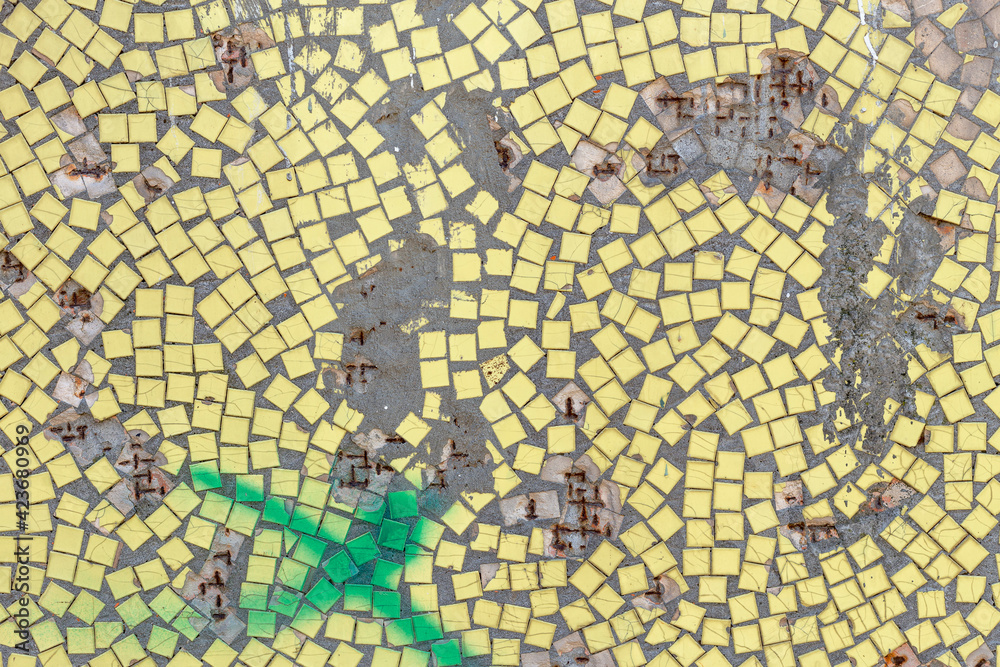 Fototapeta premium Old yellow mosaic wall with hole and rust, background from old mosaic.