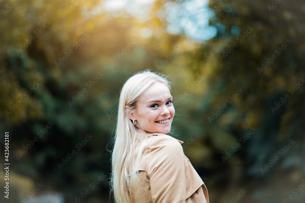 Portrait of smiling blond girl in nature. Portrait of smiling blond girl in nature.