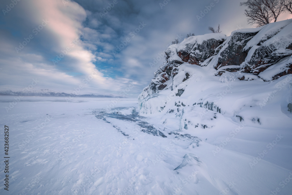 The frozen lake Torneträsk in Swedish Lapland. Beautiful ice forms create an amazing sight. The frozen lake Torneträsk in Swedish Lapland. Beautiful ice forms create an amazing sight.