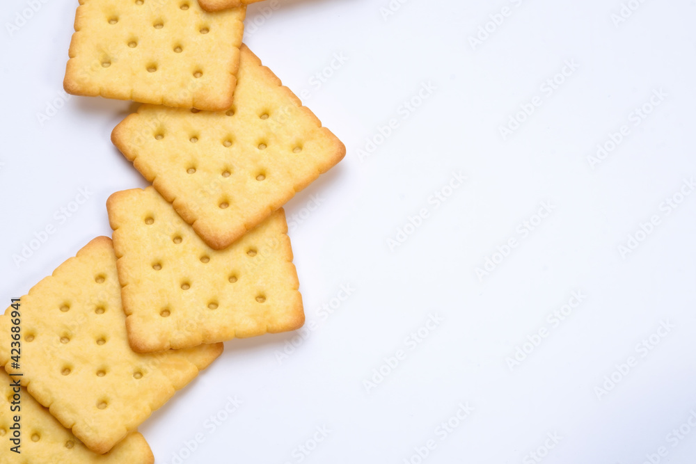 line of crackers put on white table with empty space line of crackers put on white table with empty space