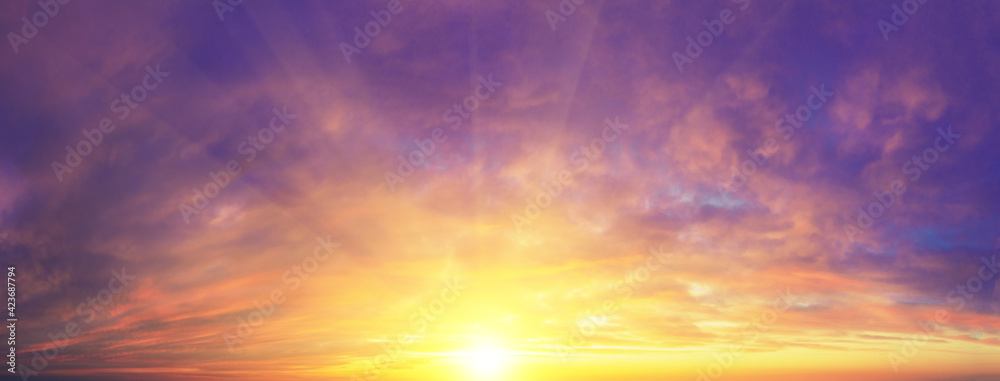 Panorama of blazing dramatic evening sky during sunset with gradient color