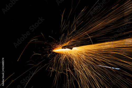 Weld sparks isolated on black background.