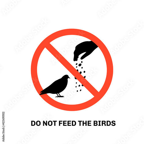 Prohibition sign with text do not feed the birds and hand silhouette giving food to pigeon. Isolated on white background. Stock vector illustration.