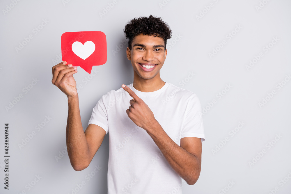 Portrait of brunet optimistic curly nice guy point like wear white t-shirt isolated on grey background Portrait of brunet optimistic curly nice guy point like wear white t-shirt isolated on grey background