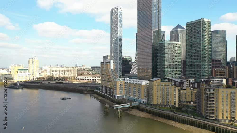 : PAN REVEAL OF TALL TOWERS IN THE CITY CENTER WITH A BEACH, AERIAL : PAN REVEAL OF TALL TOWERS IN THE CITY CENTER WITH A BEACH, AERIAL