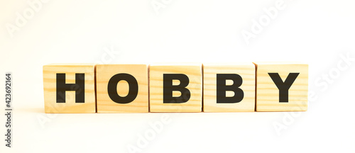 The word HOBBY. Wooden cubes with letters isolated on white background.