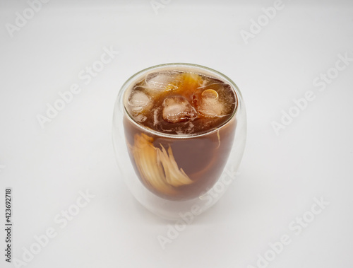 Iced coconut coffee in double walls glass isolated on white background.