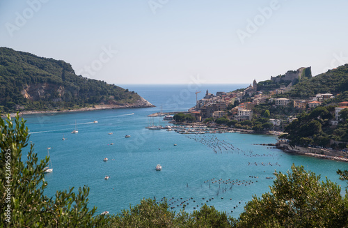 Portovenere, Liguria, Italy. June 2020. Sea view from the village hill: a magnificent view of the bay crossed by numerous boats of various sizes.
