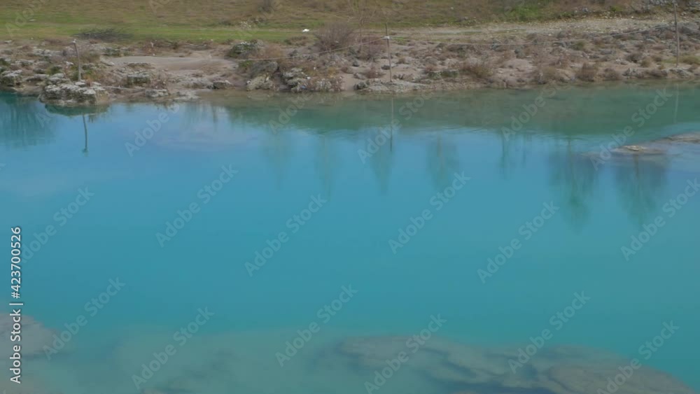 Aerial view to the waterfall in canyon. Flow of the blue water in the river. Wild nature in Montenegro, Podgorica. Vacation in Europe Aerial view to the waterfall in canyon. Flow of the blue water in the river. Wild nature in Montenegro, Podgorica. Vacation in Europe
