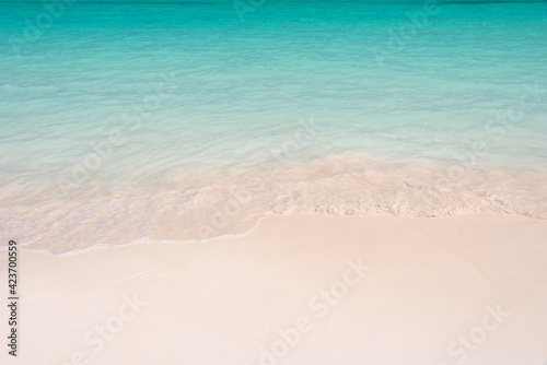 Sand and caribbean tropical beach, summer background with copy space © Delphotostock