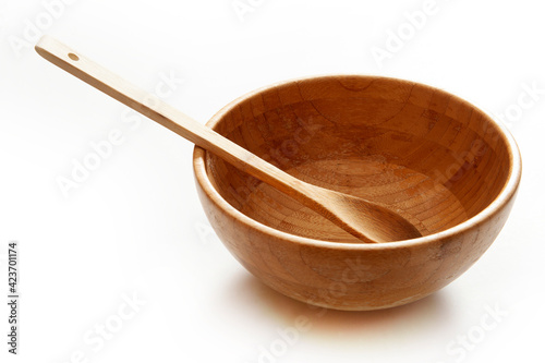 Bamboo plate and spoon on a white background.