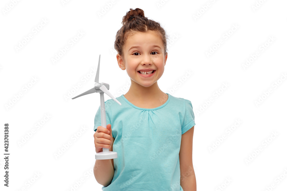 sustainable energy, power and people concept - happy smiling girl with toy wind turbine over white background sustainable energy, power and people concept - happy smiling girl with toy wind turbine over white background